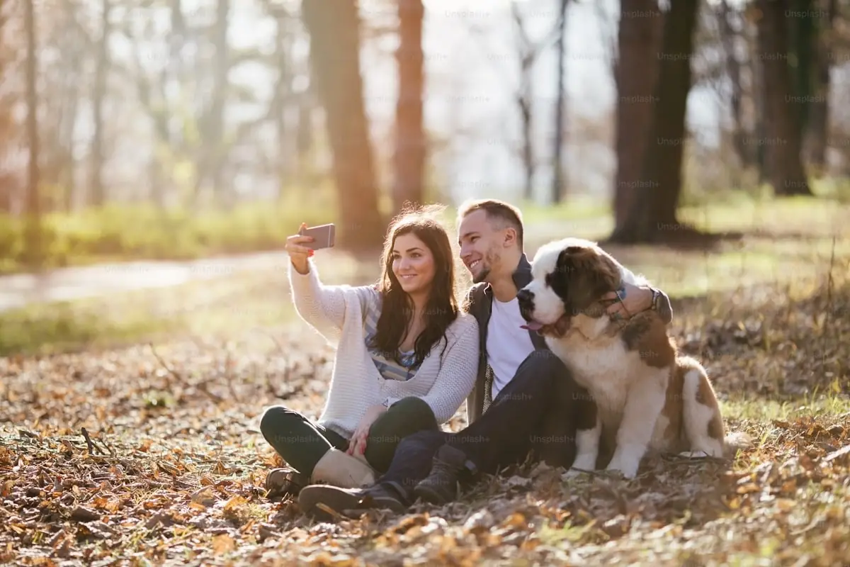 Happy pet owners with their beloved pets Happy pet owners with their beloved pets